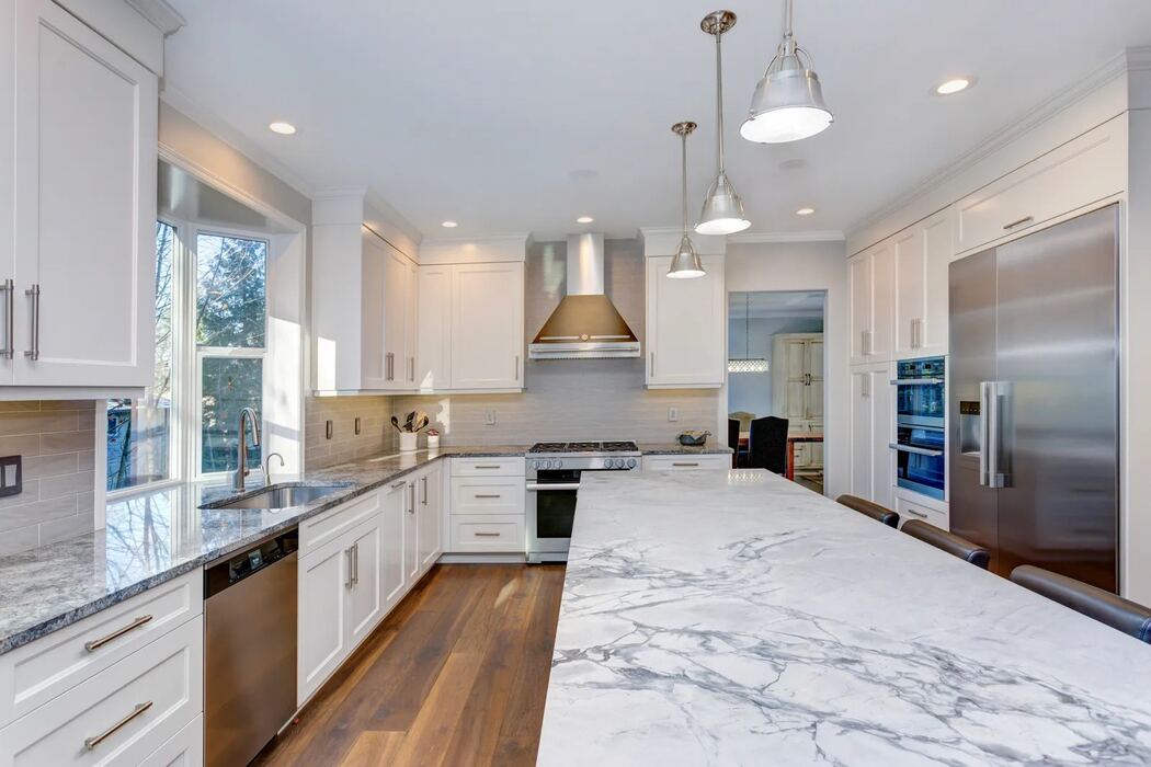 Luxe kitchen with granite island countertop